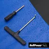 Two tools, a screwdriver and a T-handle allen wrench, rest on a wet blue surface next to a black textured material. Produktbild-Vorschau