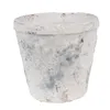 A close-up studio shot of a single, weathered terracotta pot with a distressed white and blue finish. Podgląd zdjęcia produktu