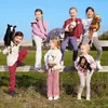 Children playing with hobby horses outdoors on a sunny day. Náhľad obrázku produktu