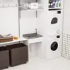 A laundry room with a sink, washing machine, and laundry baskets. Náhľad obrázku produktu