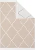 A beige rug with a white diamond pattern is shown from a top-down perspective, with one corner folded back. Náhľad obrázku produktu