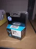 A product shot of an HP ink cartridge in its packaging, placed on a shelf. Produktbild-Vorschau