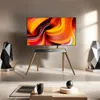 A modern living room setting with a TV on a stylish stand, flanked by decorative objects, and a coffee table in the foreground. Podgląd zdjęcia produktu