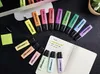 A collection of STABILO BOSS ORIGINAL Pastel highlighters arranged on a black surface next to an open notebook and sticky notes. Anteprima dell’immagine prodotto