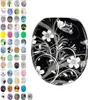 A toilet seat with a black background and white and gray floral and butterfly pattern, displayed next to a grid of smaller images of other toilet seat designs. Produktbild-Vorschau