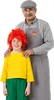 An adult man and a child are posing for a photo. The child is wearing a costume. Produktbild-Vorschau