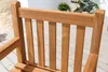 Close-up view of the back of a wooden garden chair. Produktbild-Vorschau