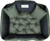 A top-down view of a green and black dog bed with two small pillows. Voir les images du produit