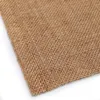 A close-up view of a woven burlap fabric. Náhled obrázku produktu