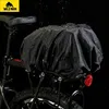 A black bicycle saddlebag is shown on a bicycle rack, with water droplets on it, suggesting it is waterproof. Produktbild-Vorschau