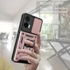 A hand holding a rose gold phone case with a ring holder, with a blurred indoor background. Produktbild-Vorschau