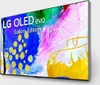 A television screen displaying abstract art with text overlay. Produktbild-Vorschau