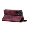 A burgundy flip case for a smartphone is shown standing upright on a white background. Produktbild-Vorschau