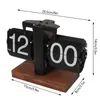 A black flip clock with a wooden base is shown with dimensions indicated. Náhled obrázku produktu