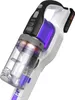 A close-up, angled view of a white and black handheld vacuum cleaner with purple accents, set against a white background. Podgląd zdjęcia produktu