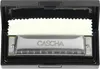 A harmonica is shown inside its black case, with a white cloth lining. Voir les images du produit