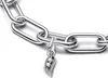 A close-up shot of a silver bracelet with a dangling charm. Anteprima dell’immagine prodotto