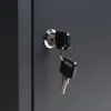 A close-up shot of a lock with two keys inserted into it. Produktbild-Vorschau