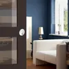 A modern living room with a blue wall, a white sofa, and a window with blinds. Produktbild-Vorschau