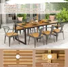 An outdoor dining set with a table and chairs, featuring a parasol and greenery in the background. Close-up insets show details of the table's wood grain and a hole for an umbrella. Podgląd zdjęcia produktu
