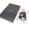 A Canon flatbed scanner and its accessories are laid out on a white background. Produktbild-Vorschau