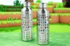 Two silver water bottles with Minecraft-themed designs are displayed on a green surface with a pixelated background. Podgląd zdjęcia produktu