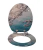 A toilet seat with a cherry blossom design. Produktbild-Vorschau