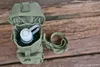 A tactical bottle holder with a water bottle inside, placed on a wooden surface. Produktbild-Vorschau