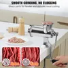 A manual meat grinder is shown on a kitchen counter with ground meat and two grinding plates. Produktbild-Vorschau