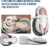A collage of images showing a baby sleep aid product in its packaging, a baby sleeping in the product, and different views of the product itself. Produktbild-Vorschau