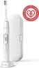A white electric toothbrush with its charging base and travel case, next to a red circular logo. Náhľad obrázku produktu