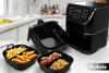 A black air fryer and its accessories are displayed on a kitchen counter. Náhled obrázku produktu