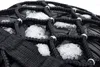 A close-up view of a tire with snow chains attached, showing ice and snow caught in the chains. Náhľad obrázku produktu