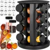 A black spice rack organizer with 16 glass jars filled with various spices, shown with additional wooden spoons and bowls of spices. Produktbild-Vorschau
