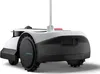 A rear view of a white and black robotic lawn mower on a white background. Voir les images du produit
