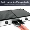 Close-up of a grill with a hand pulling out a drip tray. Produktbild-Vorschau
