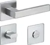 A set of stainless steel door handles and escutcheons on a white background. Produktbild-Vorschau