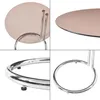 Collage of four close-up shots of a round side table with a brown glass top and chrome legs. Anteprima dell’immagine prodotto