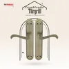 A pair of antique-style door handles are displayed against a patterned background, framed by an archway graphic. Produktbild-Vorschau