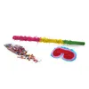 A pinata stick, a bag of confetti, and a blindfold are laid out on a white background. Produktbild-Vorschau