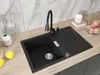 A black kitchen sink with a modern faucet and a wooden countertop. Produktbild-Vorschau