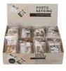 A display box of photo keyrings, with some keyrings visible inside and some on the front. Produktbild-Vorschau