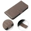 A gray flip cover phone case with floral embossing, shown from a slightly elevated angle, with two close-up insets showing the clasp detail. Produktbild-Vorschau