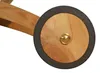 A close-up of a wooden wheel with a black rubber rim and a brass center cap, attached to a wooden frame. Produktbild-Vorschau