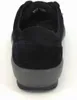 The back view of a black shoe with a gray sole against a white background. Produktbild-Vorschau