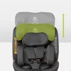 A close-up of a car seat with a green headrest attachment. Náhled obrázku produktu