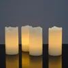 Four LED candles are arranged on a reflective black surface against a dark gray background. Produktbild-Vorschau