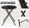 A black folding table with details of its construction. Produktbild-Vorschau