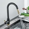 A close-up view of a modern kitchen faucet with water running into a sink. Náhľad obrázku produktu