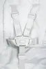 A close-up view of a white baby high chair harness. Produktbild-Vorschau